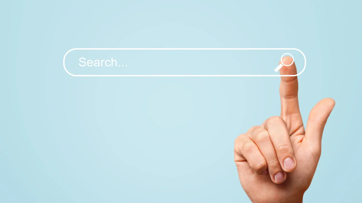 Trustworthy Lumber & Truss Services | Kansas City Area | North Country Lumber & Truss A finger presses a search bar in the middle of the image. The background is light blue.
